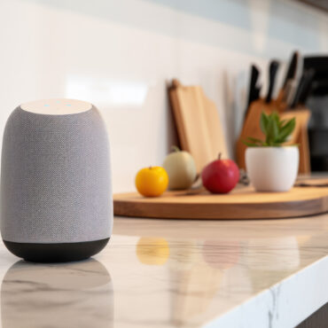 Smart speaker, virtual assistant with AI voice recognition, on a kitchen counter